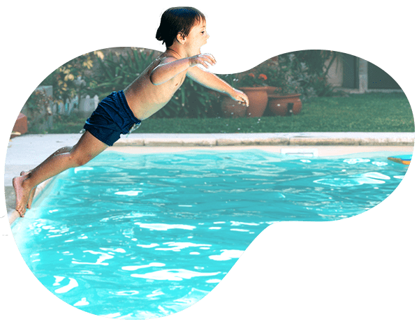 Boy jumping into pool